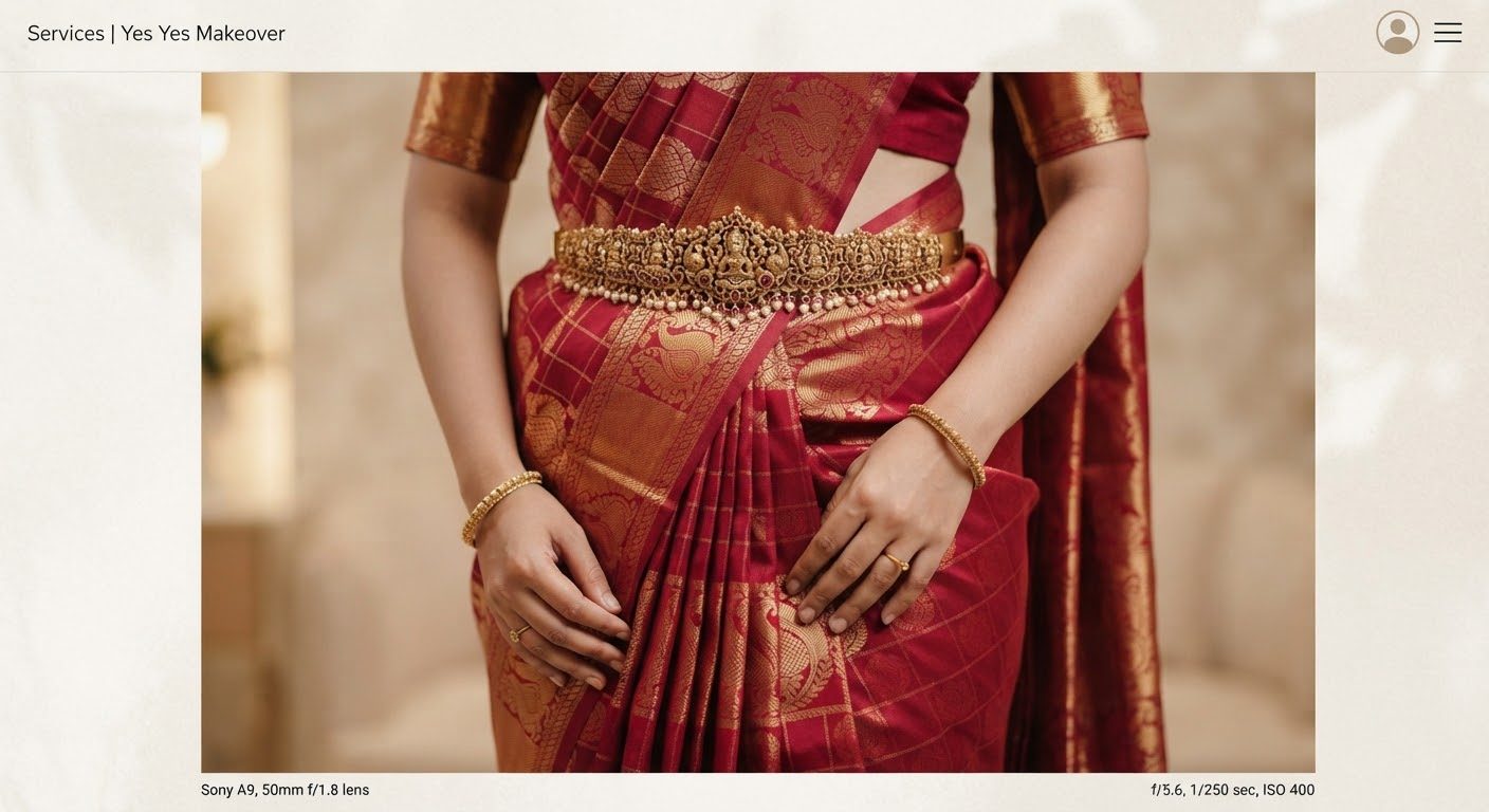 Close up of a luxury crimson and gold Kanjeevaram silk saree perfectly box pleated, pinned with antique gold waist belt oddiyanam, showing exquisite pleat precision